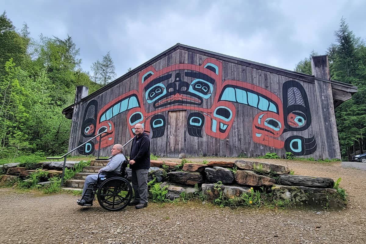 Someone in a wheelchair at the Saxman Native Village