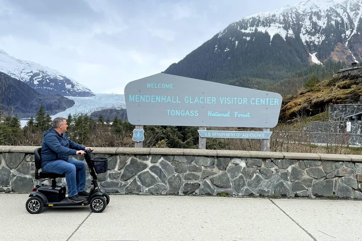 Visitor with a power wheelchair at Mendenhall Glacier in Juneau, Alaska