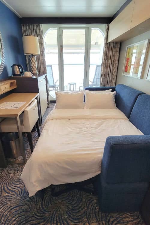 A sofabed made up on a Royal Caribbean ship