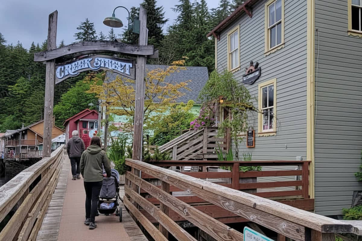 Woman walking with a stroller on Creek Street