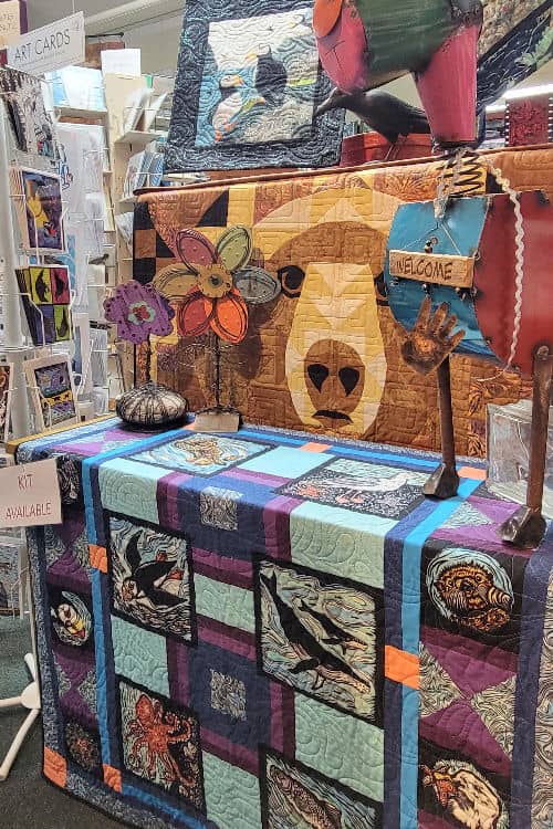 Finished quilts at Changing Tides quilt shop
